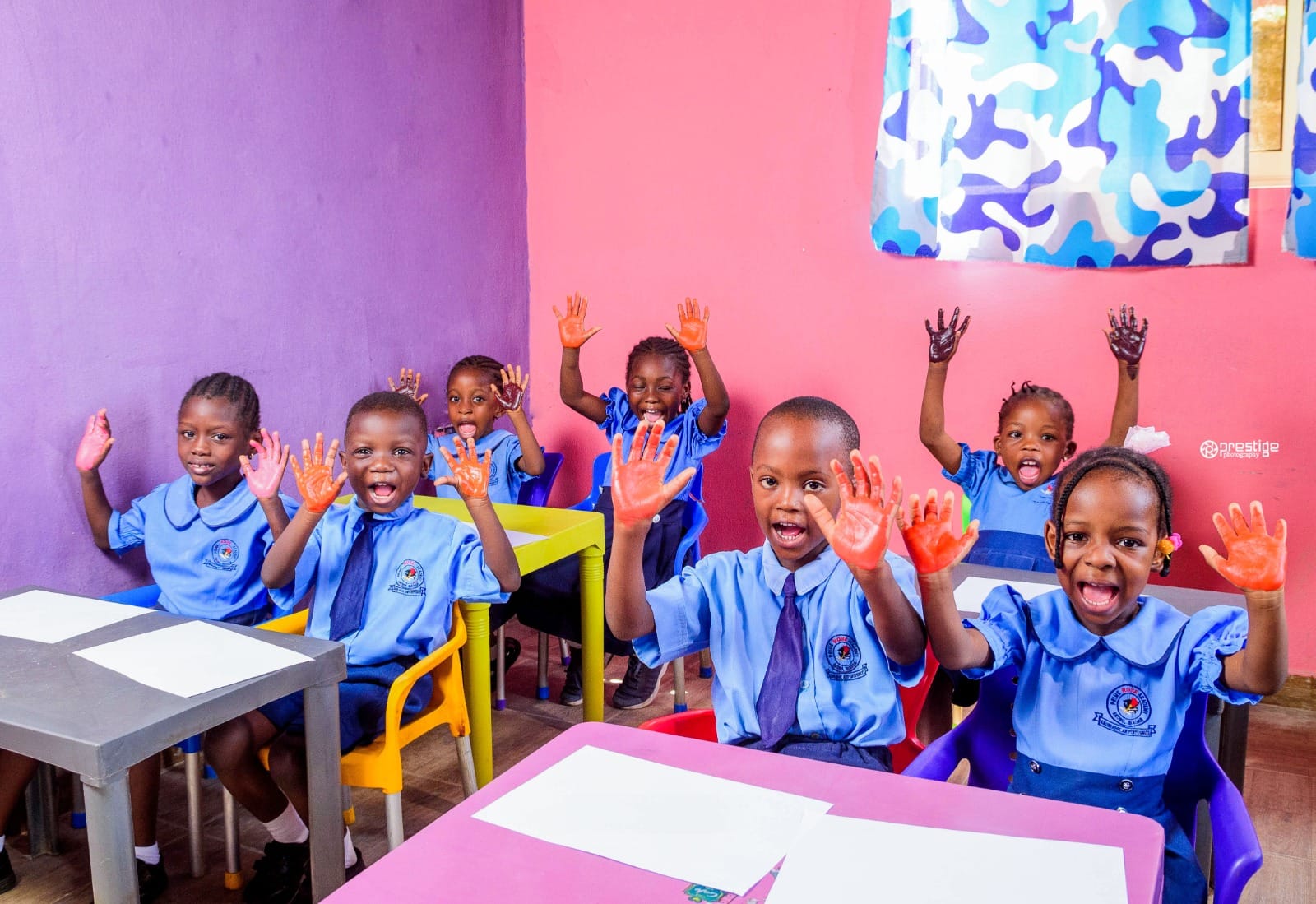 Prime Rose Academy pupils with painted hands raised